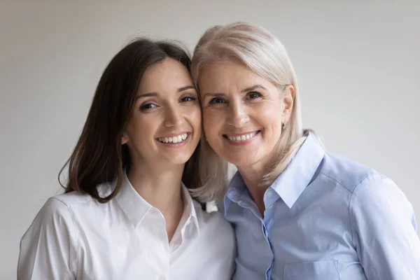 Portrait of happy senior 60s mother and young grownup daughter — Stock Photo, Image