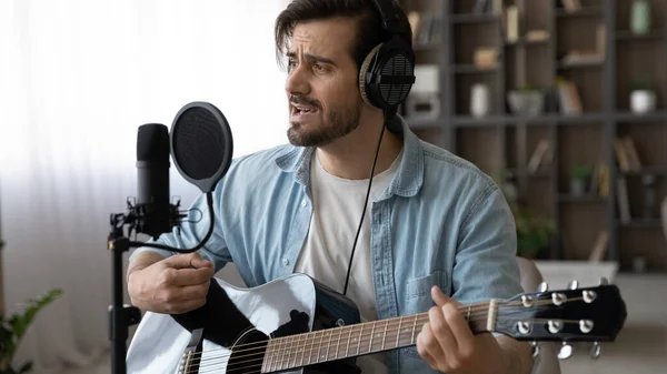 Happy young male musician creating own music. — Stock Photo, Image