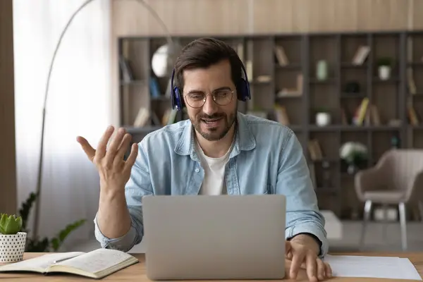Happy smiling young businessman holding video call. — Stock Photo, Image