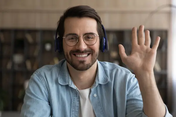 Sincere smiling young businessman holding video call conversation. — Stock Photo, Image