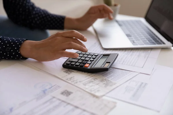 Close up cropped of Indian woman calculating and paying bills — Stok Foto