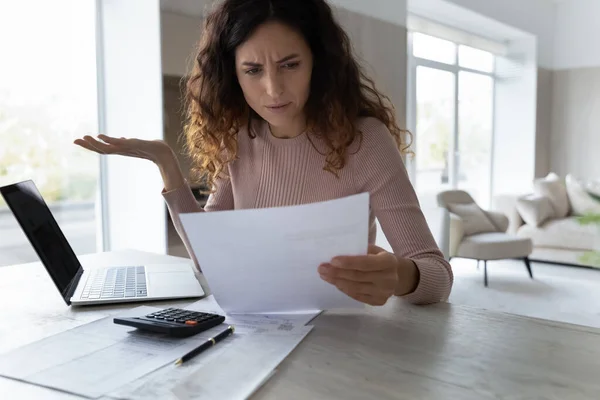 Confused Latin woman distressed with news in document — Foto de Stock