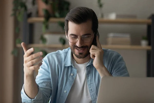 Millennial business man talk on phone to client