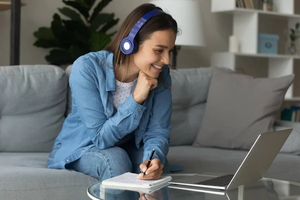 Woman e-learn use laptop listen audio course through wireless headphones — Stock Photo, Image