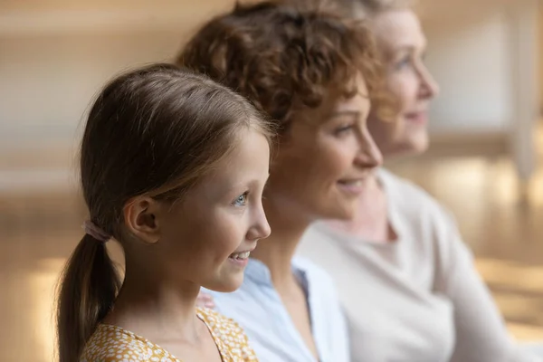 Head shot profile portrait of smiling three generations of women — Stock Photo, Image