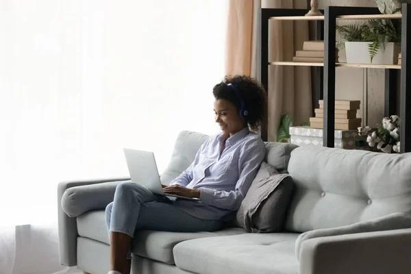 Happy biracial woman talk on video call on computer