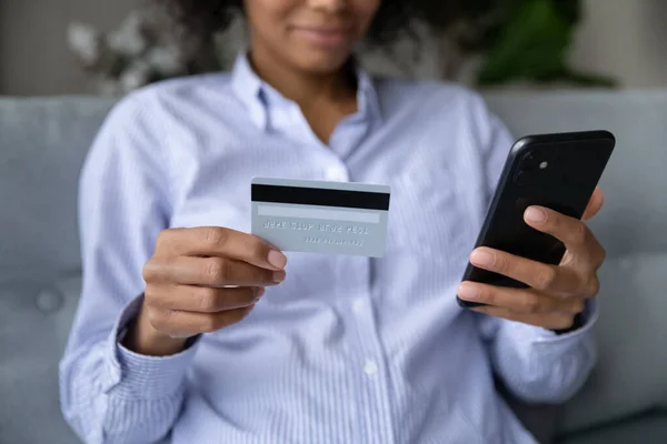 Close up of biracial woman make payment on smartphone — Stock Photo, Image