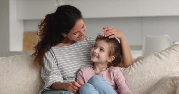 Affectionate caring young mother cuddling preteen daughter. — Stock Video