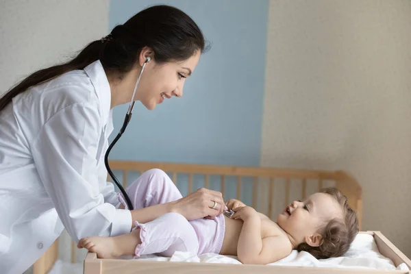 Caring female doctor examine small baby in hospital — Stock Photo, Image