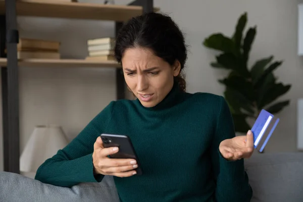 Close up confused woman having problem with credit card — Stock Photo, Image