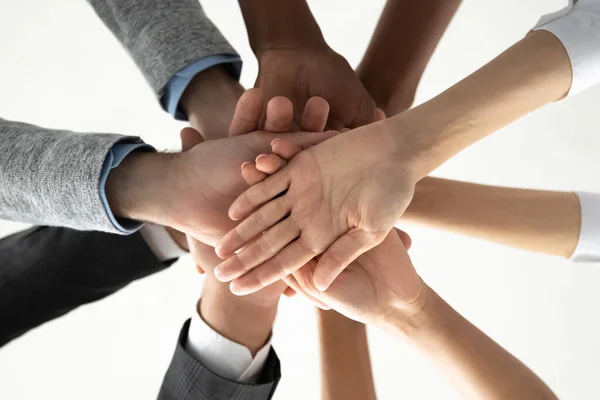 Close up of diverse people stack hands for shared success — Stock Photo, Image