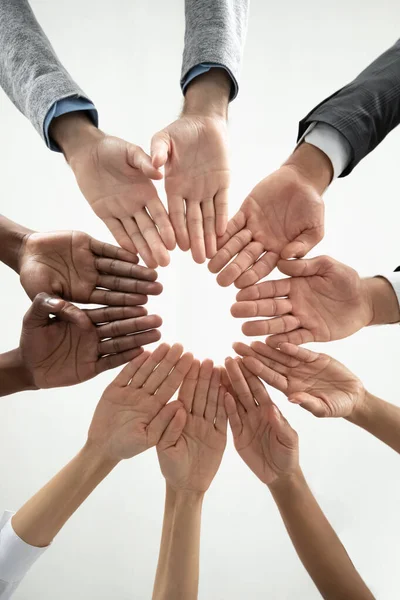 Close up of diverse people join hands in circle — Stock Photo, Image