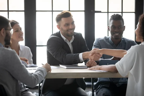 Smiling businesspeople handshake get acquainted at meeting — Stock Photo, Image