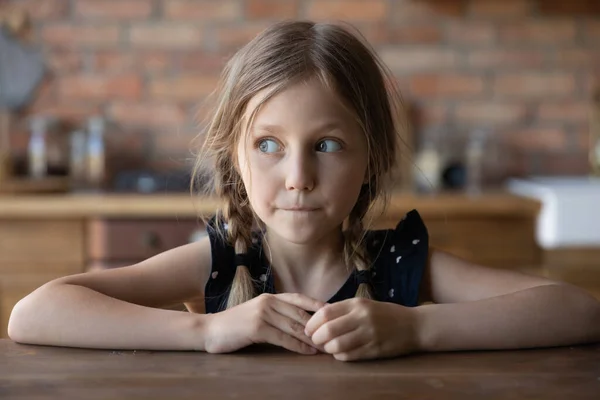 Head shot of sly little girl with guilty scared face — Stock Photo, Image