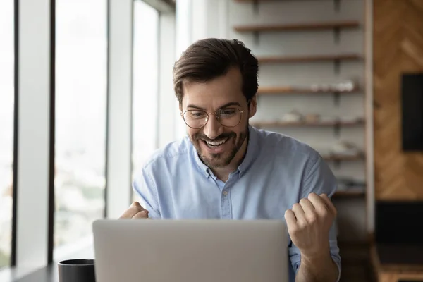 Happy excited laptop user getting amazing good news — Stock Photo, Image