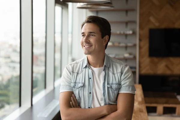 Portrait of happy pensive businessman in casual looking at window — Stock Photo, Image