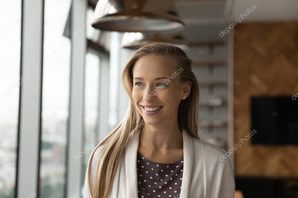 Portrait of happy thoughtful young business woman, leader, entrepreneur