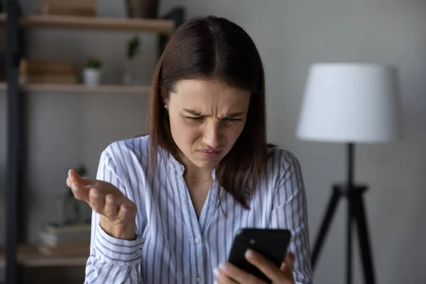 Unhappy woman distressed having problems with cellphone — Foto de Stock