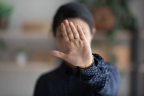 Young ethnic woman show stop hand gesture — Stockfoto