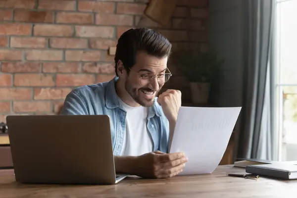 Excited Caucasian man feel euphoric with news in letter — Stock Photo, Image