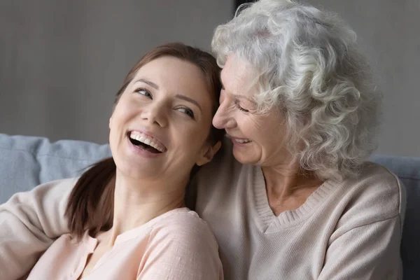 Smiling mature mother and adult daughter hugging — Foto Stock