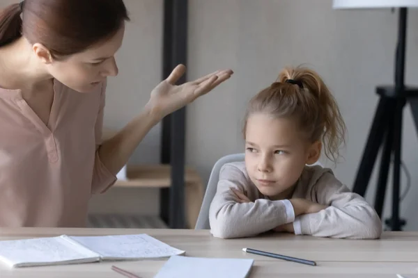 Unhappy mom scold lazy unmotivated daughter studying