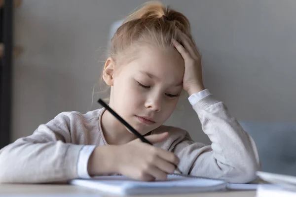 Bored small girl unmotivated to study at home — Stock Photo, Image