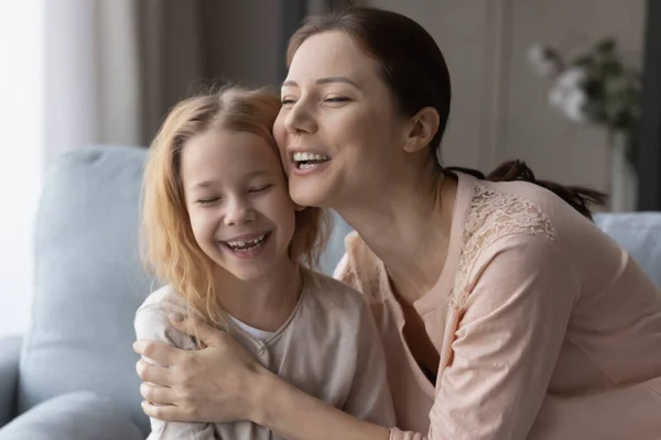 Happy mom and small daughter hug and cuddle — Photo