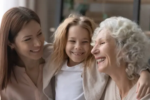 Happy three generations of women play together at home — Stock Photo, Image