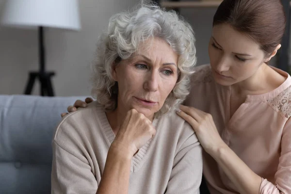 Caring adult daughter comfort unhappy mature mom — Stock Photo, Image