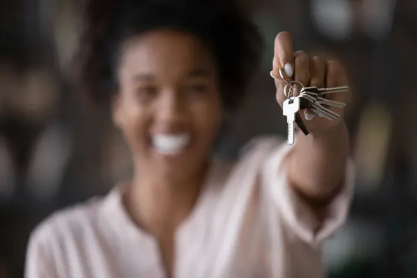 Close up of woman show keys to new home — Stock Photo, Image