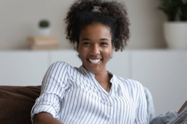 Portrait of smiling biracial woman relax at home