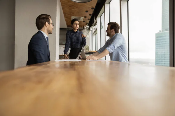 Multi ethnic colleagues brainstorming together in modern office boardroom — Stock Photo, Image