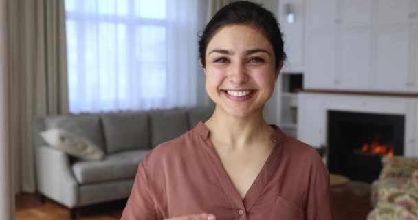 Happy Indian woman holding keys smile looks at camera — Stockvideo