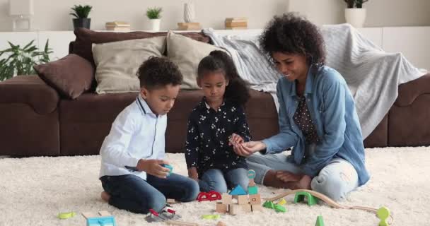 Joyful single mixed race mum playing with little children. — Vídeo de Stock