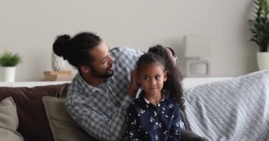 Loving multiracial family getting ready for walk.