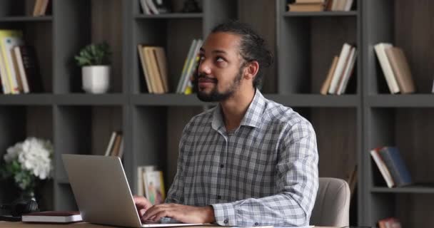 Happy young african american man working distantly. — Video