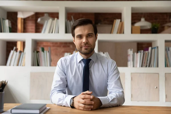 Portrait of intelligent executive manager posing seated at workplace desk — Stock Photo, Image