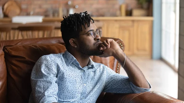 Thoughtful bored millennial Black mixed race guy lost in thoughts — Stock Photo, Image