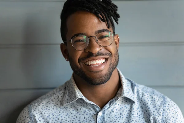 Head shot of happy African American guy with trendy haircut — Stock Photo, Image