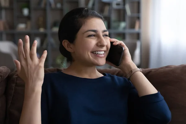 Smiling Indian woman have pleasant cellphone call — Stock Photo, Image