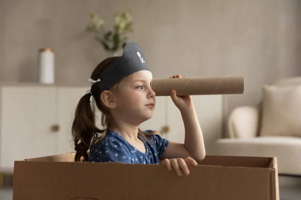 Funny cute kid girl playing pirate at home — Stock Photo, Image