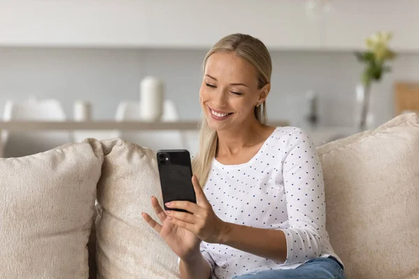 Happy pretty millennial woman taking selfie, photo on mobile phone — Stock Photo, Image