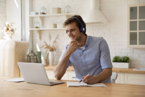 Smiling millennial man studying on online courses. — Stock Photo, Image