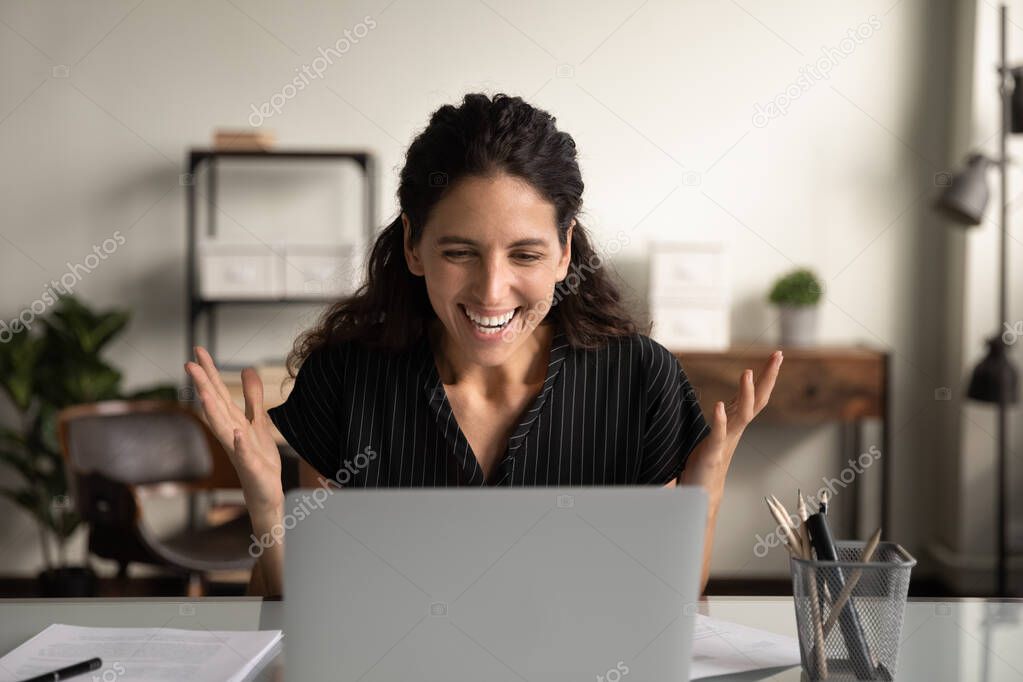 Happy excited businesswoman surprised and overjoyed with good news