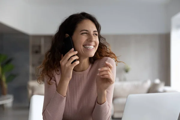 Smiling attractive hispanic woman holding phone call conversation. — Stock Photo, Image