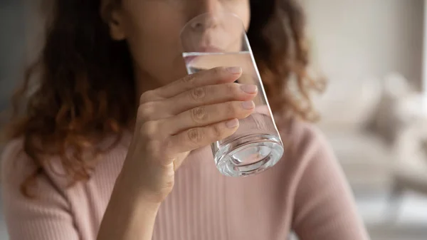 Close up young woman drinking glass of fresh pure water. — Stock Photo, Image