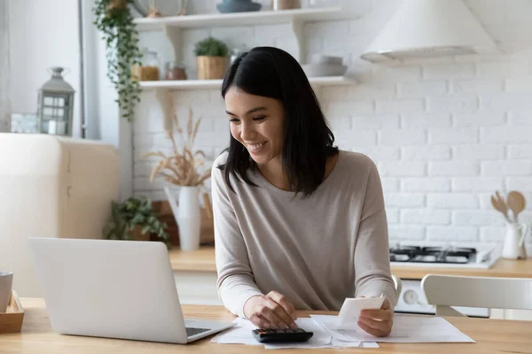 Happy young asian korean woman managing household budget. — Stock Photo, Image