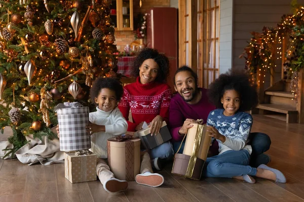 Portrait of happy ethnic family on Christmas morning