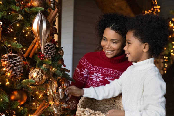 Happy biracial mother and son prepare for New Year — Stock Photo, Image